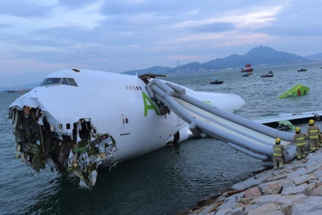 A cargo plane has crashed off the runway in Hong Kong, killing two ground staff